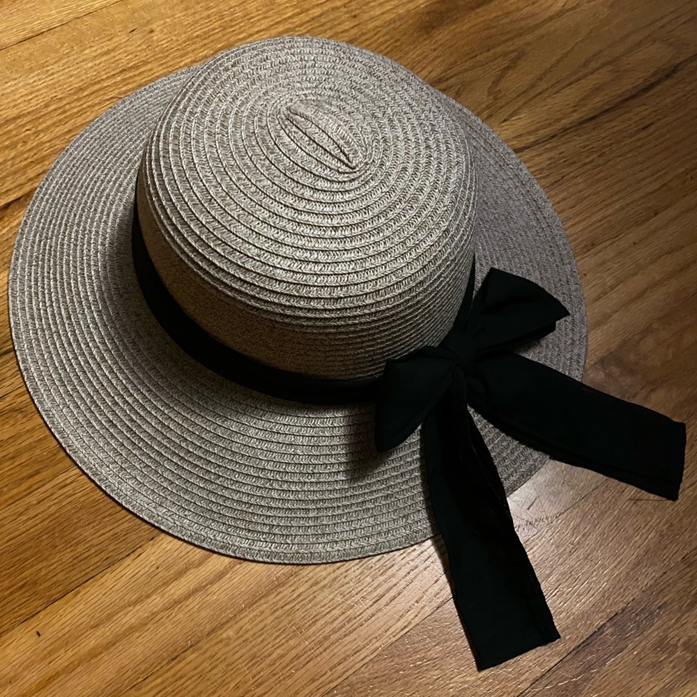 Eufora tan colored sun hat with black ribbon tie